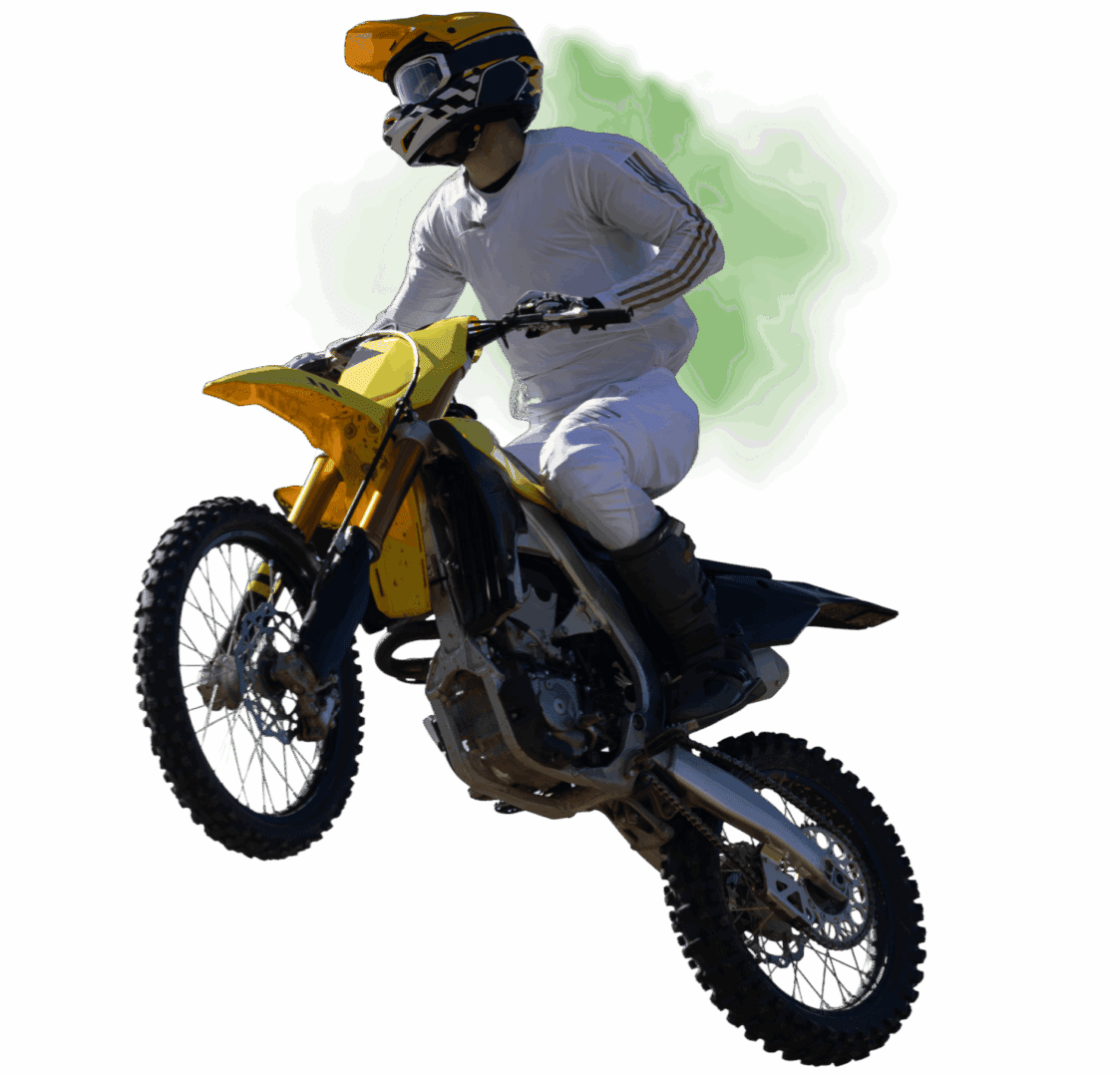 Motorcyclist performing a jump on a dirt bike.